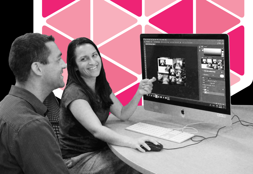 Black and White photo of consultant Jamila showing patron Eric how to do design in Photoshop in the DesignLab. The background has been removed and has a black background with part of the magenta and white DesignLab hexagon logo