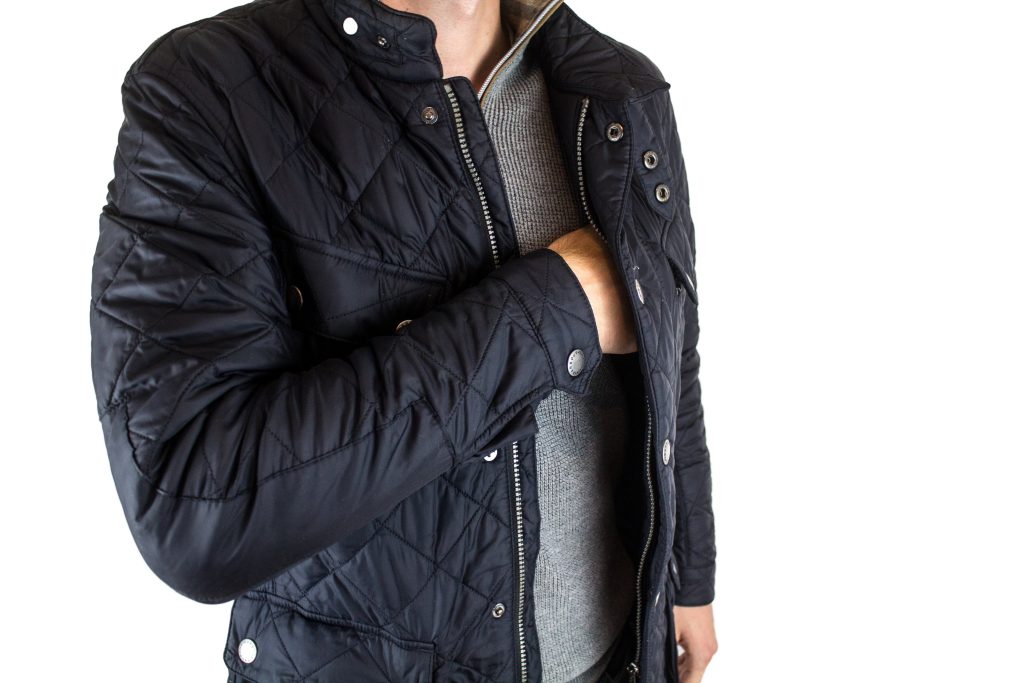 A man in a black nylon winter jacket